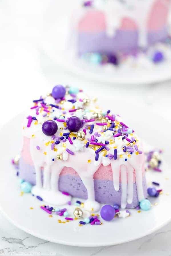 Bath bomb with a purple and pink theme in the shape of a birthday cake
