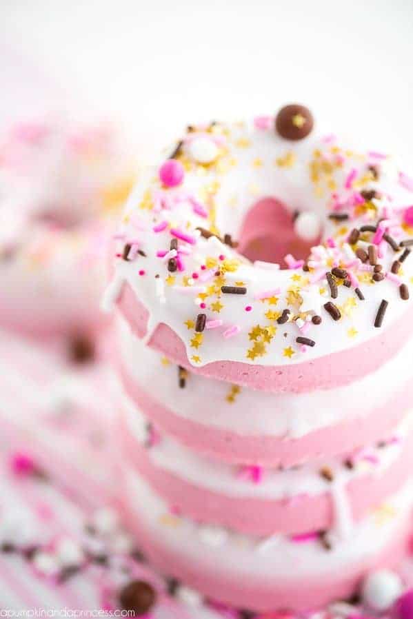 pink and white donut shaped bath bombs with sprinkles