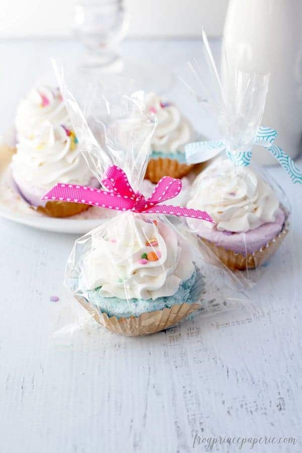 fizzy bath bombs in the shape of cupcakes wrapped in cellophane with a bow ribbon