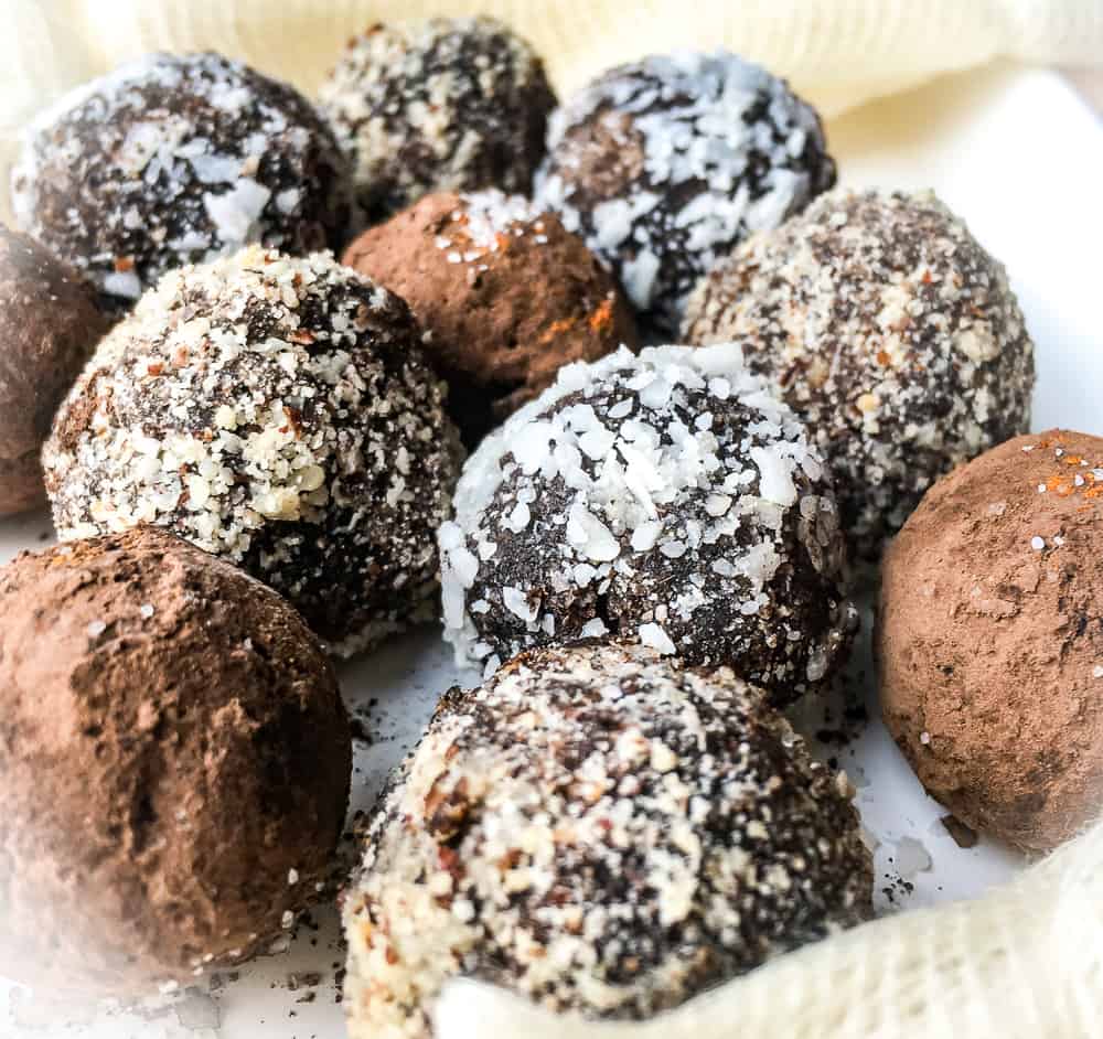 chocolate truffles covered in cocoa powder, coconut and ground nuts