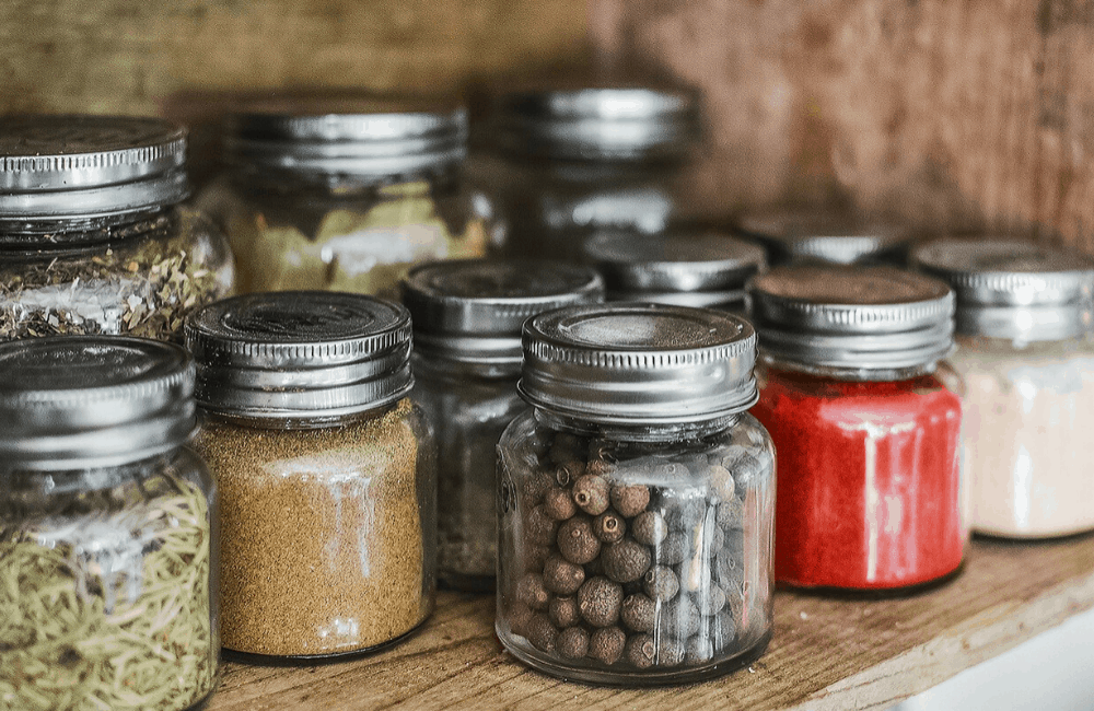 Jarred kitchen ingredients in store cupboard for easy cooking