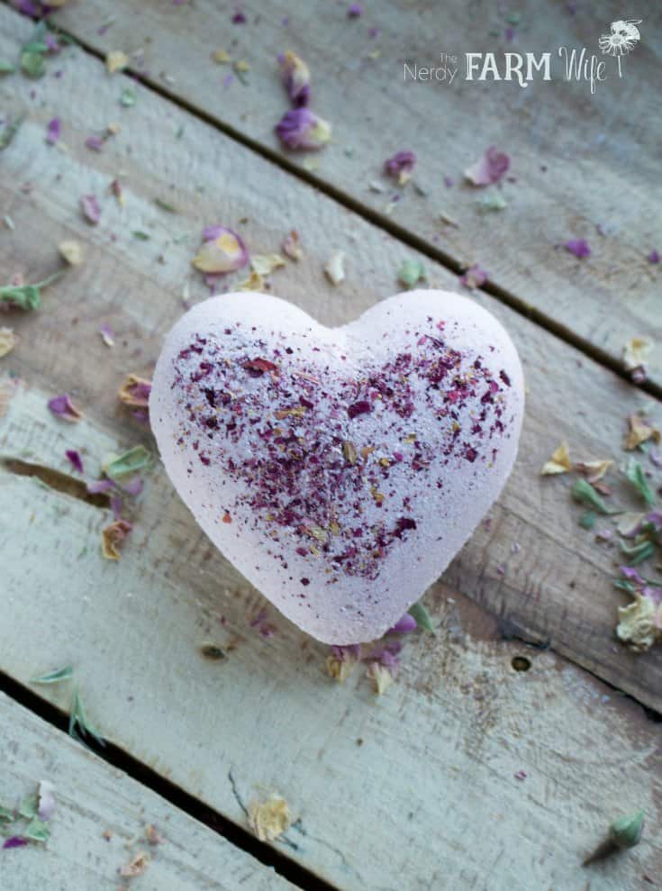 white heart shaped bath bomb with rose sprinkles