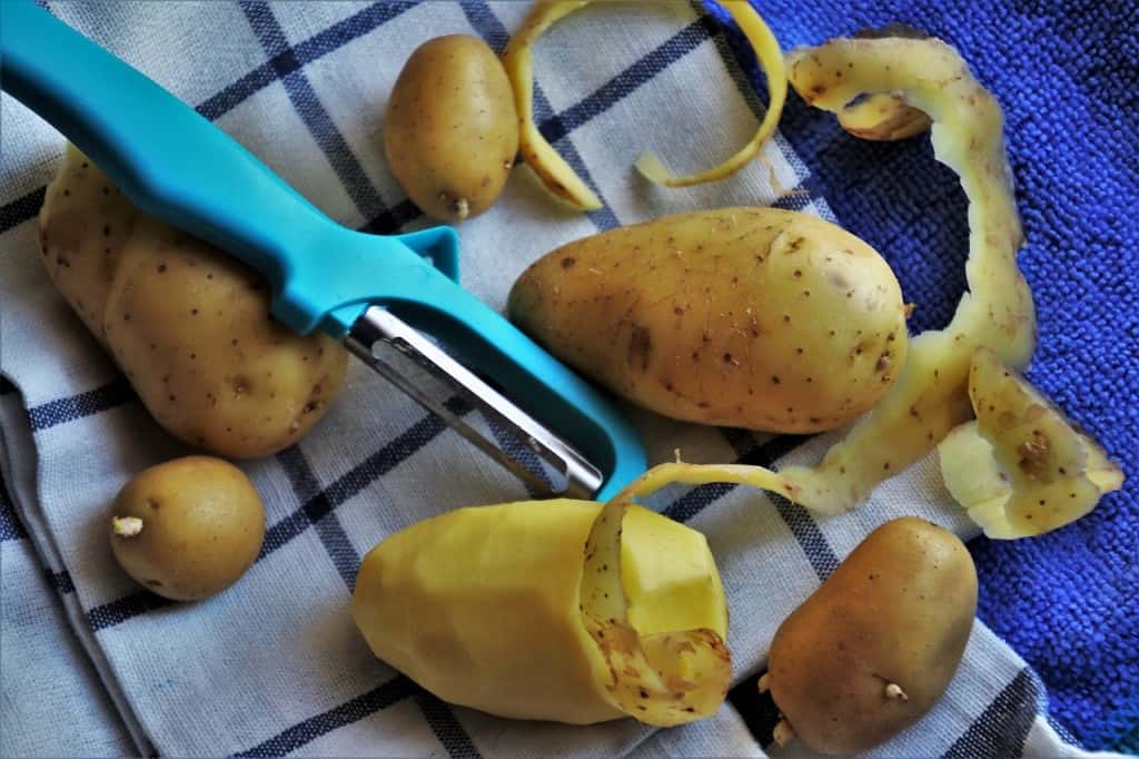 Potatoes being peeled