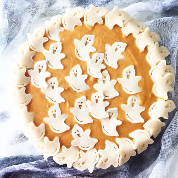 Halloween pumpkin pie with decorative ghosts