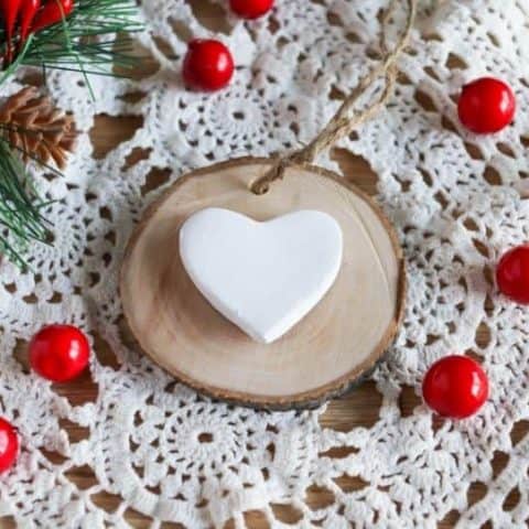 rustic wood slice Christmas ornaments with doily and cranberries