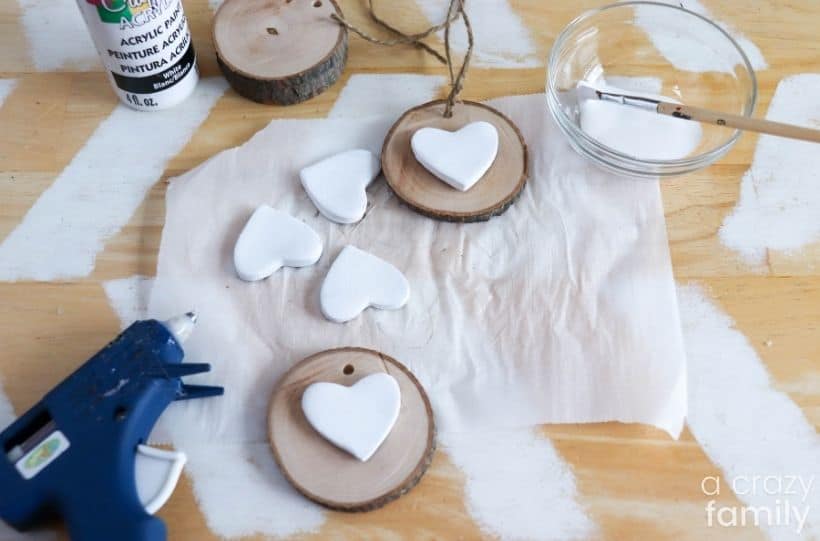 clay hearts glued onto wood slices