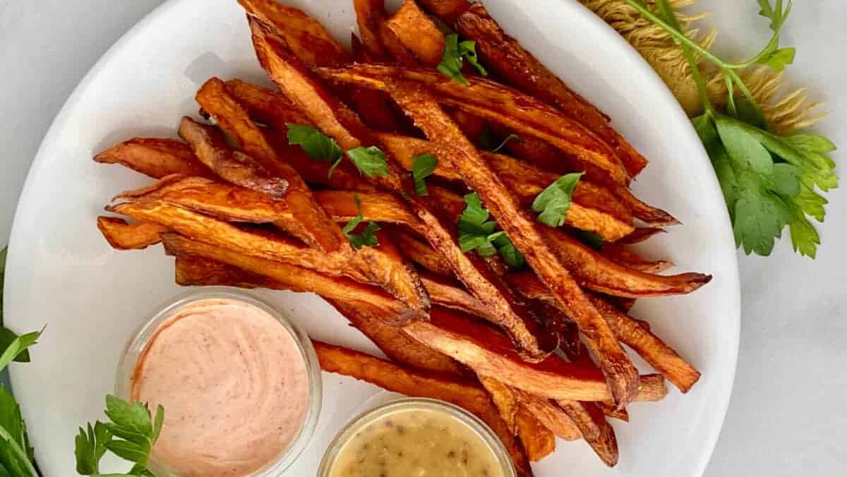 Deep Fried Sweet Potato Fries featured close up with dipping sauces on the bottom e1630350266842