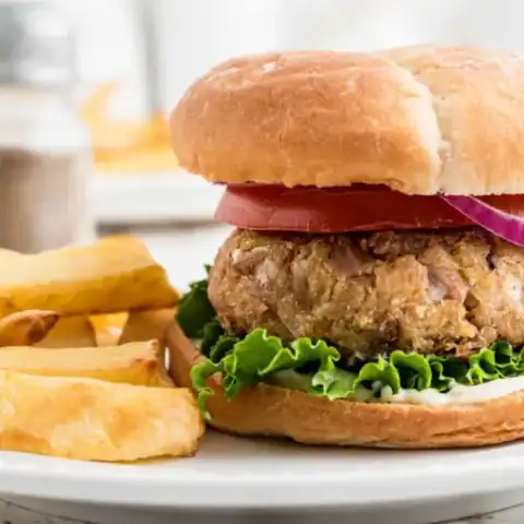 Homemade tuna burger on bun served with fries 768&times;512.jpg