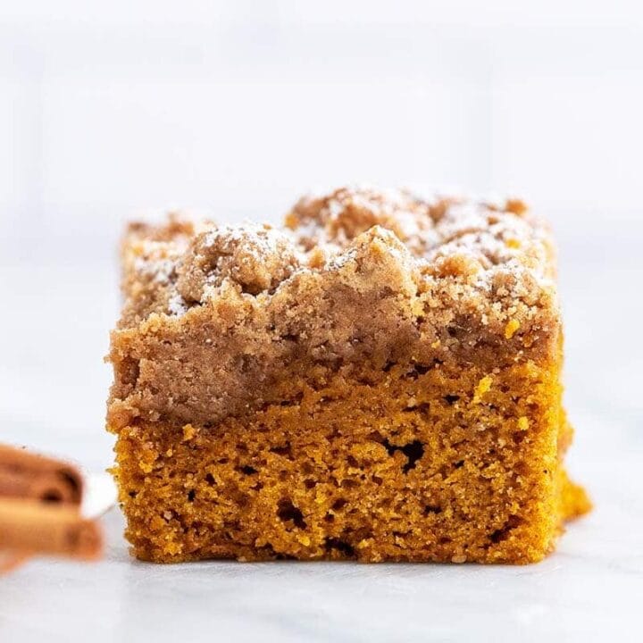 close up front view of square of pumpkin crumb cake on marble countertop.jpg