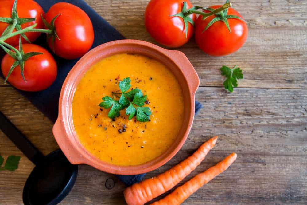Vegetable,Tomato,And,Carrot,Soup,In,Ceramic,Pot,And,Ingredients